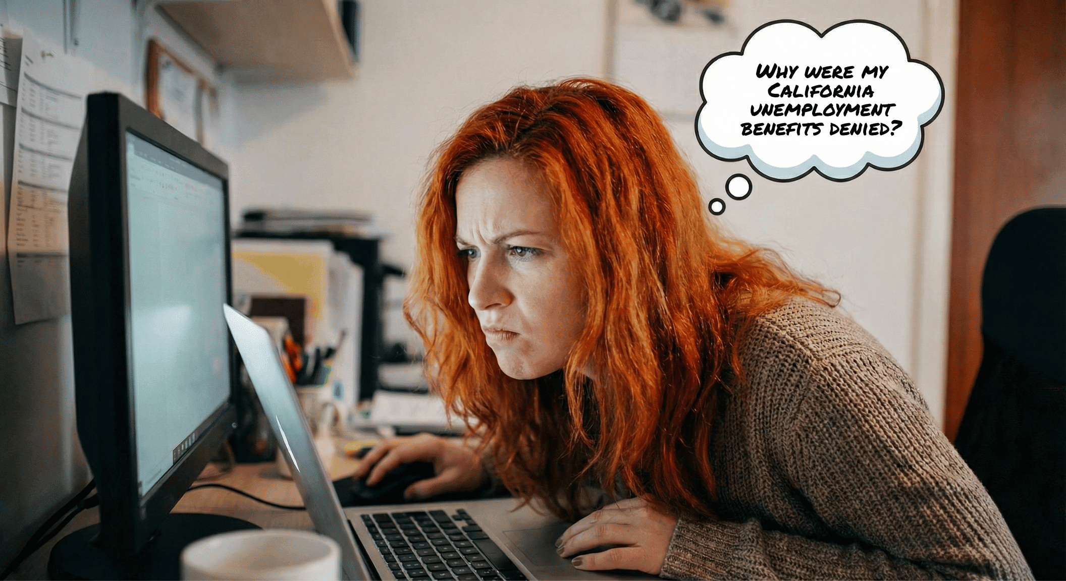 A red-headed woman in her early thirties angrily looking at her computer with a thought bubble above her head that reads, "Why were my California unemployment benefits denied?"
